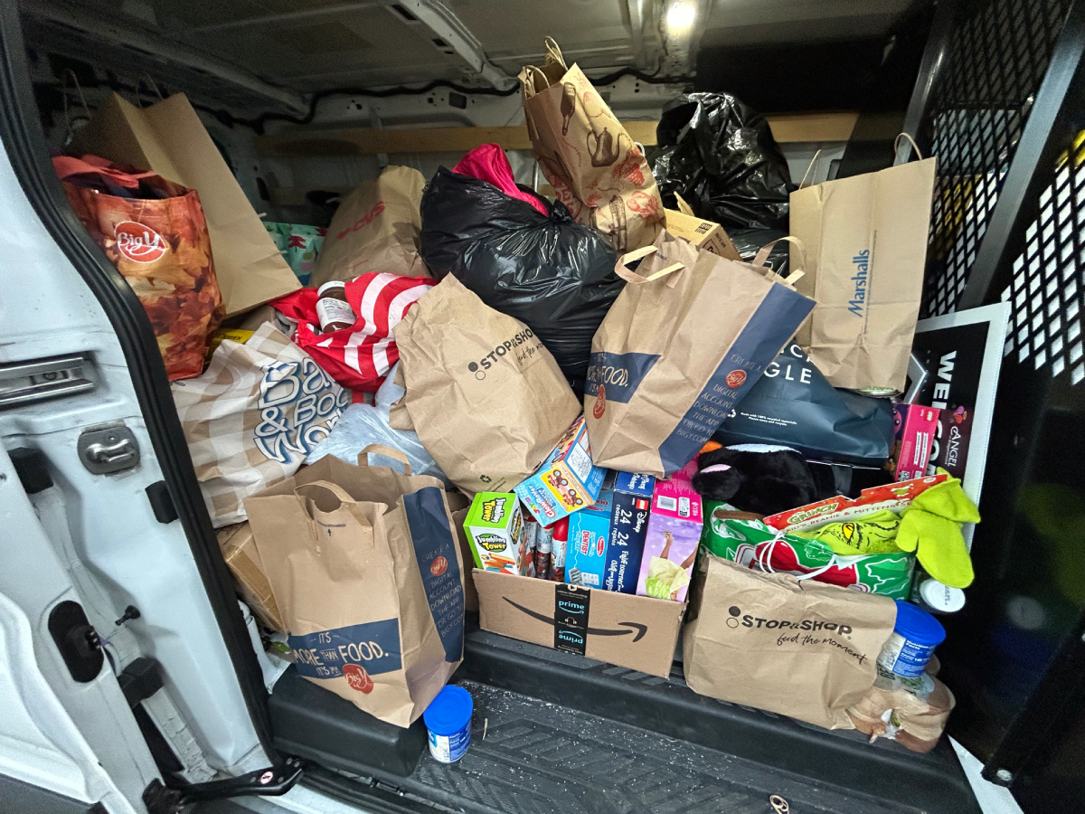 Team of volunteers setting up a community event to support local families