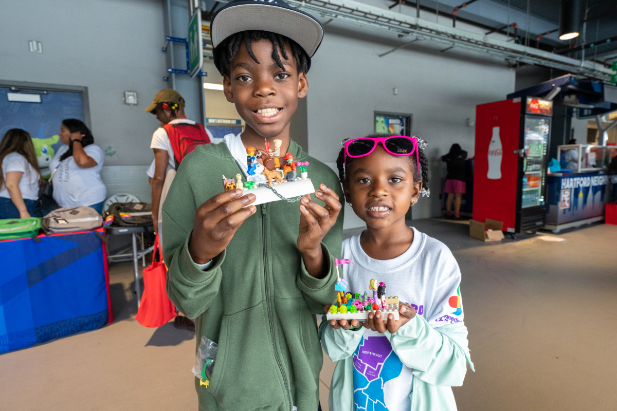 Team of volunteers setting up a community event to support local families