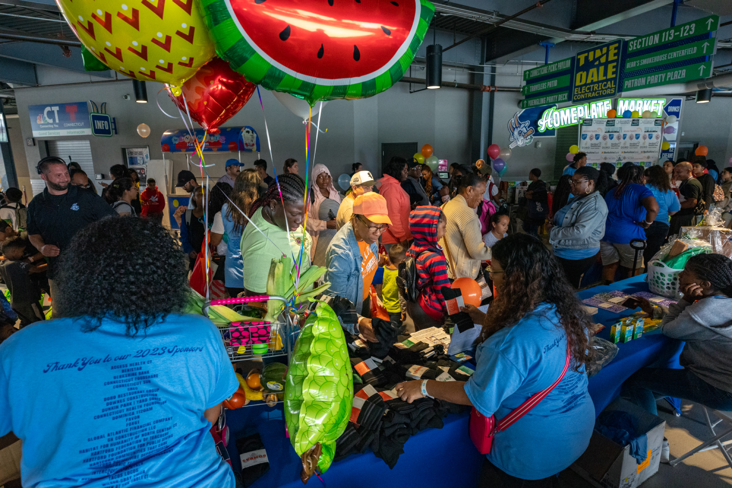 Team of volunteers setting up a community event to support local families