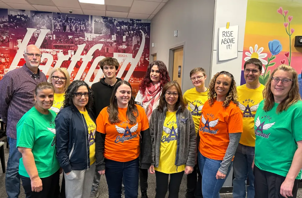 Smiling children receiving toys from Santa at a community toy drive